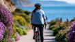© Kateryna - A European cyclist viewed from behind rides softly along a bright sunny coastal path in soft daylight coastal cycling faceless back view bright outdoors daylight workspace
