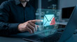 © HADI INCREDIBLE - Businessman interacting with a holographic email warning icon on a digital interface representing cybersecurity threats and phishing attacks