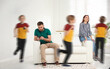 © New Africa - Family with hyperactive child. Son running around tired parents at home