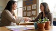 © velikiyzayats - Parent Teacher Conference Meeting Handshake in Classroom Setting for School Partnership and Communication
