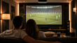 © Aino Minako - Home theater sports night with couple watching match on large screen