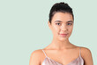 © Pixel-Shot - Young woman with beautiful lips on green background, closeup