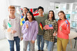 © Pixel-Shot - Young students with flags at language school