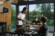 © Aleksei Isachenko/imageBROKER - A mother serves a healthy meal to her two children at a stylish kitchen table surrounded by large windows. Sunlight fills the space, highlighting fresh ingredients and homey decor
