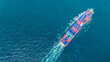 © Yellow Boat - Cargo container ship loaded with freight boxes navigating through vibrant turquoise ocean water. Concept of global maritime logistics, international shipping trade, and supply chain network.