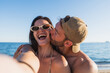© Martí Rosselló - Young couple enjoying romantic kiss on summer beach