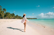 © Stock Latino - Woman enjoying tropical beach in Dominican Republic, Saona Island