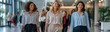 © pattozher - Diverse women leading the way in a modern office lobby. Capturing confidence and collaboration in a professional setting, highlighting female empowerment and progress in the business world.