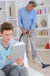 © auremar - father uses a vacuum cleaner