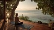© Madon Sapi - Woman meditating ocean sunset deck
