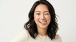 © Coosh448 - Beautiful young Asian woman portrait winking and sticking out tongue, playful beauty expression fashion studio concept youth charm confidence and fun personality, clean bright background, soft light,
