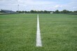 © Fotograf - A football field with a goal in the middle, ideal for sports and fitness related content