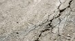 © Iwan - Cracked Concrete Surface with Texture and Detail, Close-Up View of a Fractured Ground