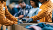 © Laura - Faceless group sorting donated items for community charity distribution event, sorting activity, charitable work, community service, donation organization, with copy space