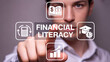 © Samirkhattak - Man interacting with financial literacy icons on virtual screen
