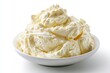 © morepiixel - A white bowl filled with creamy, smooth, whipped cream or frosting on a white background.