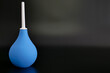 © Hanna - Blue enema bulb syringe on dark background. High quality photo