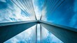 © Harry - Low angle view of a massive modern cable stayed bridge against a clear blue sky