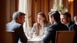 © AnnovaGraphics - Business professionals enjoying a fine dining experience together at a restaurant table