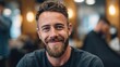 © RndVisuals - Smiling man with beard and stylish haircut in a barber shop setting