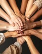 © Dg - Diverse group of hands united in a circle symbolizing teamwork and unity.