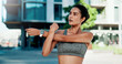 © peopleimages.com - Stretching, thinking and woman in city for fitness, health and mobility to prepare for exercise. Runner, sports and person with warm up for wellness, injury prevention and arm muscle for active hobby