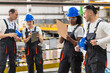 © BusinessClass by W61 - Team of engineers discussing maintenance indoors