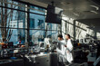 © BusinessClass by W61 - Scientist working on a screen in a bright modern laboratory