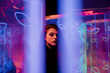 © VISTA by Westend61 - Mysterious portrait looking through glowing blue neon lights