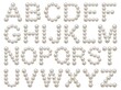 © Mono - Pearl alphabet letters on white background.
