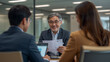 © bephoto - 明るいオフィスで日本人上司が後輩に仕事を教える研修写真