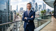 © LarisaM - Confident man stands with arms crossed on urban rooftop balcony. City skyline looms behind him, full of modern glass towers. He smiles warmly, exuding professional assurance