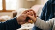 © UMAMA - Two hands clasped together in a moment of connection or support