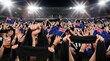 © Mr. Bolota - New Zealand fans waving flags and scarves at a sporting event