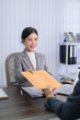 © snowing12 - Asian lawyer businesswoman giving document receiving file from client meeting consultation at modern office desk professional legal service business workplace