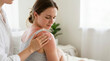 © Xenia - Hand applying soothing cream to severe red sunburn on woman's shoulder. Young female patient receiving skin care treatment for painful sun damage