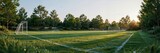 soccer pitch in a spacious garden during early morning, green grass, soft golden sunlight, trees surrounding the field, natural atmosphere