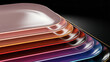 © MSTTASLIMA - A stack of shiny metallic plates in various colors on a black background