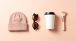 © 121icons - Knitted hat sunglasses paper cup and makeup brush arranged on transparent background