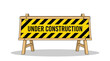 © Adobe - Bright yellow and black vector illustration of an under construction barrier sign for website maintenance