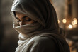 © Yan - A person wrapped in a light-colored cloth is shown in a dimly lit, warm setting.