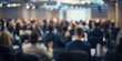 © The 2R Artificiality - Soft focus photo of a crowded conference room with people in an artistic banner