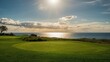 © AkuAku - Idyllic green golf course view with shimmering water and warm sunlight breaking clouds