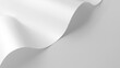 © AkuAku - Natural light softly shining on curved white paper sheet against a smooth textured background copy space