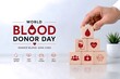 © VisionVault - World Blood Donor Day Corporate Healthcare Responsibility Concept with Business Hand Building Blood Donation Support Structure