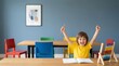 © velikiyzayats - Excited young boy celebrating academic success in a colorful classroom with an abacus and notebook, representing early childhood education and learning achievement