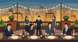 © kalimi - A group of people are dining on a rooftop