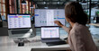 © Andrey Popov - Woman Uses Payroll Software On Laptop