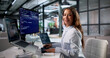 © Andrey Popov - Young Woman Coder Happily Typing New Software Code On Laptop