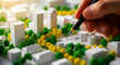 © Creative Workshop - Hand pointing at a miniature city model. Architect planning a sustainable neighborhood with tiny buildings and trees. Real estate development and urban planning concept for construction and.